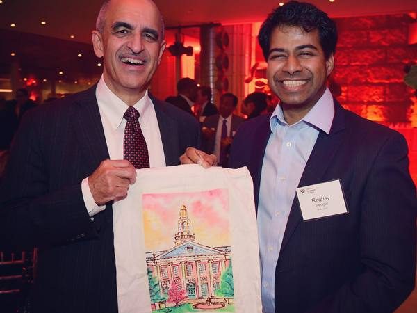 A hand-illustrated campus tote, shared at an evening reception.
